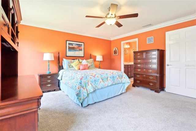 bedroom featuring light colored carpet, ornamental molding, ceiling fan, and ensuite bath
