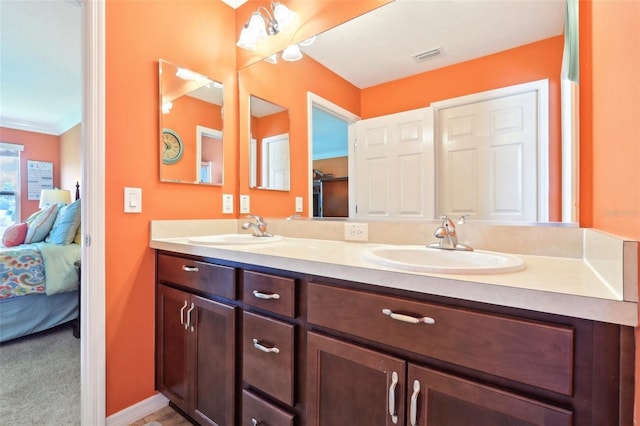 ensuite bathroom featuring double vanity