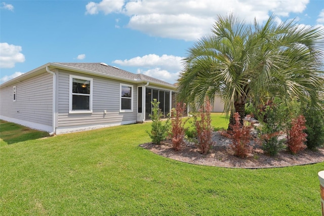 back of house with a yard