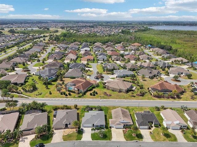 view of property location with nearby suburban area and a large body of water