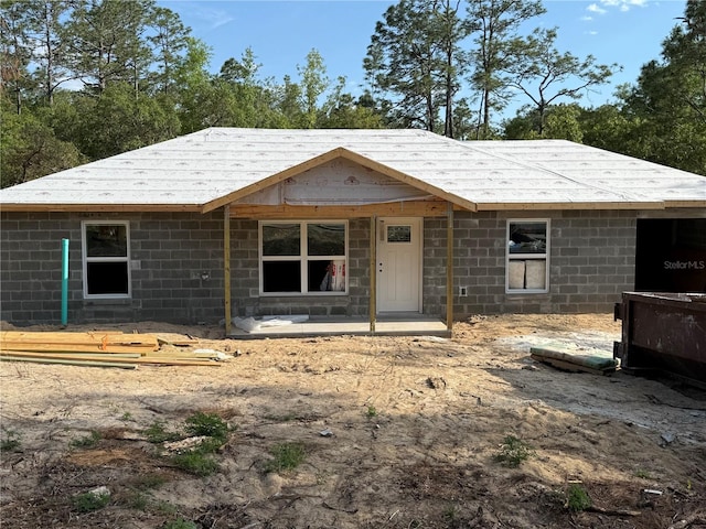 view of front of house with concrete block siding