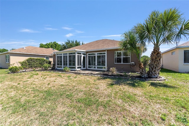 9649 SW 90th St, Ocala, FL 34481 - rear view of house featuring a sunroom, a lawn, and stucco siding