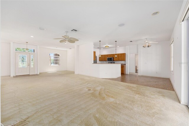 9649 SW 90th St, Ocala, FL 34481 - unfurnished living room with light colored carpet, a ceiling fan, recessed lighting, and baseboards