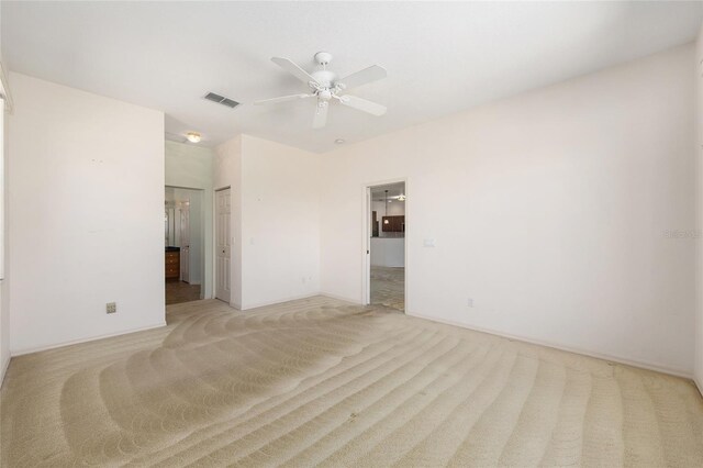 9649 SW 90th St, Ocala, FL 34481 - unfurnished bedroom featuring light colored carpet, connected bathroom, ceiling fan, and baseboards