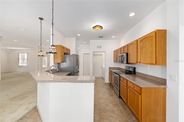 9649 SW 90th St, Ocala, FL 34481 - kitchen featuring appliances with stainless steel finishes, a peninsula, recessed lighting, pendant lighting, and open floor plan
