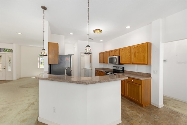 9649 SW 90th St, Ocala, FL 34481 - kitchen featuring appliances with stainless steel finishes, brown cabinets, recessed lighting, light colored carpet, and hanging light fixtures