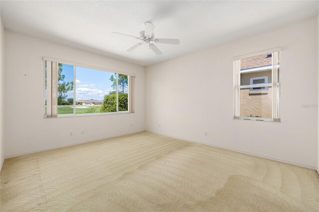9649 SW 90th St, Ocala, FL 34481 - spare room with plenty of natural light, carpet floors, and a ceiling fan