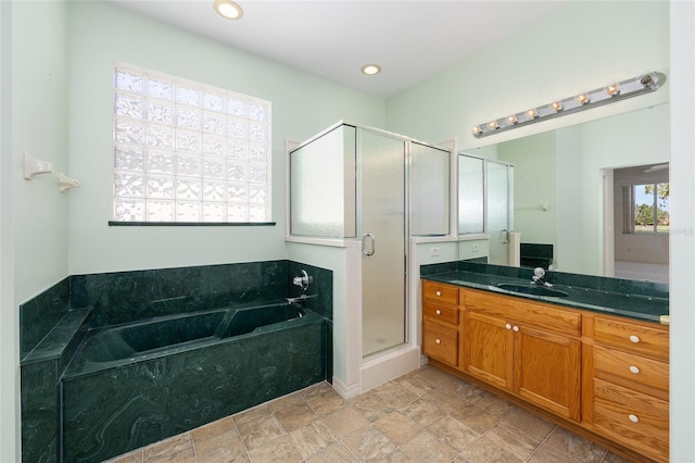 9649 SW 90th St, Ocala, FL 34481 - full bathroom with a stall shower, vanity, and a garden tub