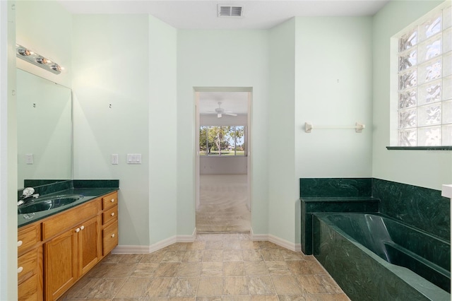 9649 SW 90th St, Ocala, FL 34481 - bathroom with vanity, baseboards, a bath, and ceiling fan