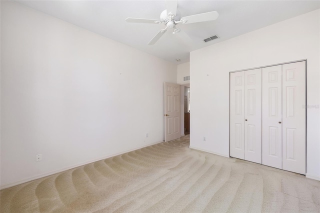 9649 SW 90th St, Ocala, FL 34481 - unfurnished bedroom featuring light carpet, ceiling fan, and a closet