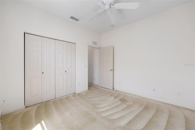 9649 SW 90th St, Ocala, FL 34481 - unfurnished bedroom featuring carpet floors, a closet, and a ceiling fan