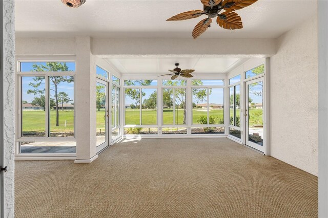 9649 SW 90th St, Ocala, FL 34481 - unfurnished sunroom with a ceiling fan, carpet flooring, french doors, and a textured wall