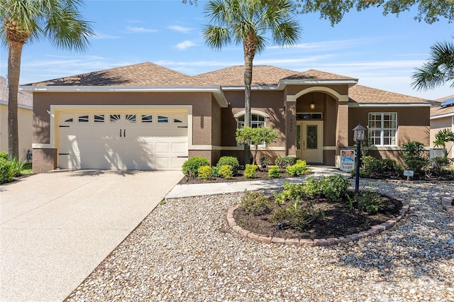 9649 SW 90th St, Ocala, FL 34481 - view of front of property with concrete driveway, a garage, and stucco siding