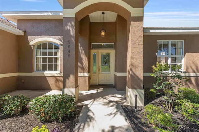 9649 SW 90th St, Ocala, FL 34481 - property entrance with stucco siding and covered porch