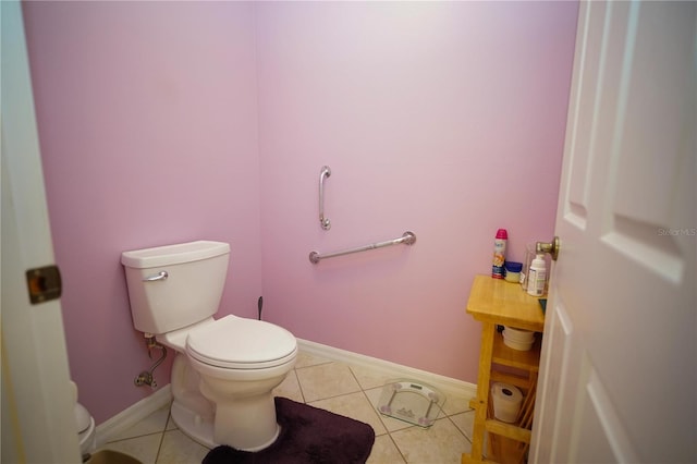 7475 SE 105th Pl, Belleview, FL 34420 - bathroom with toilet, baseboards, and tile patterned flooring