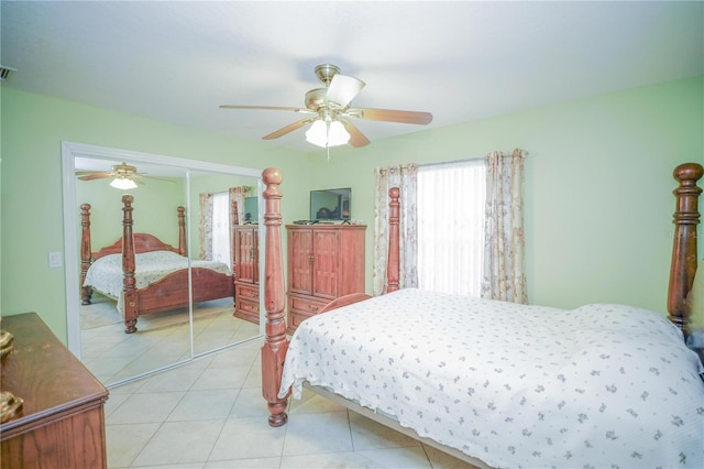7475 SE 105th Pl, Belleview, FL 34420 - bedroom featuring a closet, a ceiling fan, and light tile patterned floors