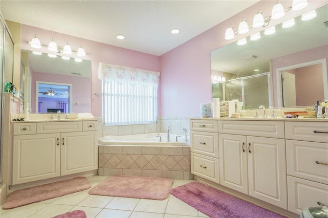 7475 SE 105th Pl, Belleview, FL 34420 - full bath with tile patterned floors, a shower stall, a garden tub, and two vanities