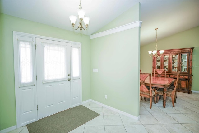 7475 SE 105th Pl, Belleview, FL 34420 - foyer entrance featuring a chandelier, vaulted ceiling, light tile patterned floors, and baseboards