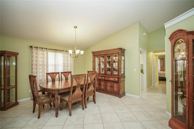 7475 SE 105th Pl, Belleview, FL 34420 - dining space with a chandelier, lofted ceiling, light tile patterned floors, and baseboards