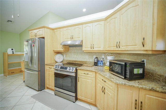 7475 SE 105th Pl, Belleview, FL 34420 - kitchen with appliances with stainless steel finishes, light brown cabinets, under cabinet range hood, lofted ceiling, and light stone countertops