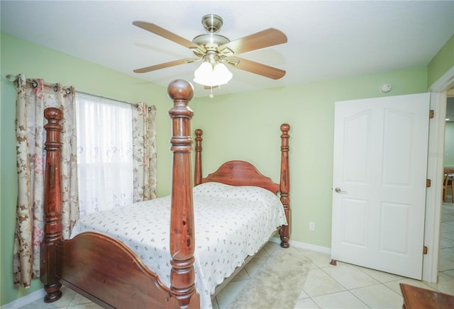 7475 SE 105th Pl, Belleview, FL 34420 - tiled bedroom featuring a ceiling fan and baseboards
