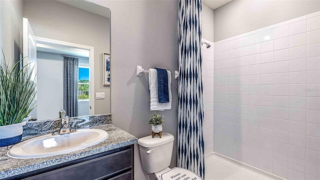 4532 SW 56th Pl, Gainesville, FL 32608 - full bathroom featuring toilet, a shower stall, and vanity