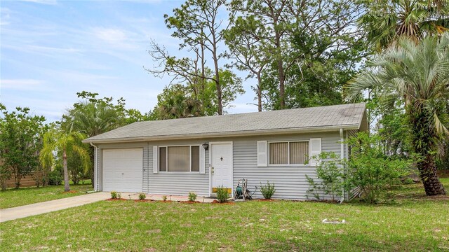 8449 SW 105th Pl, Ocala, FL 34481 - ranch-style home featuring a garage, concrete driveway, and a front yard
