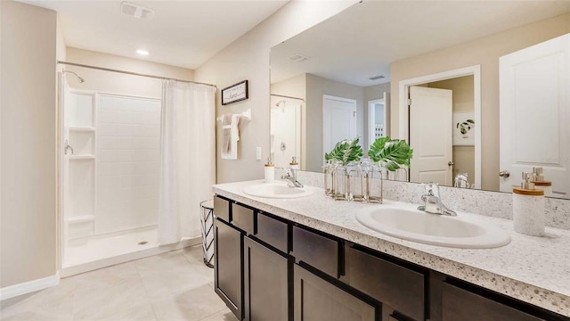 2880 NE 21st Court Rd, Ocala, FL 34470 - bathroom with a stall shower, double vanity, tile patterned flooring, and baseboards