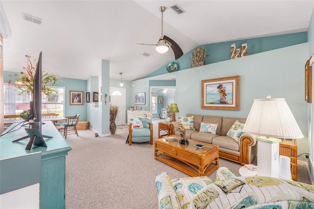 living room featuring a ceiling fan, lofted ceiling, and carpet