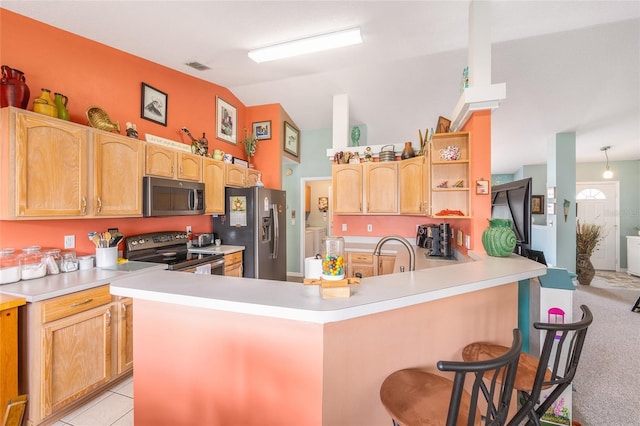 kitchen featuring stainless steel appliances, a peninsula, a sink, lofted ceiling, and open shelves