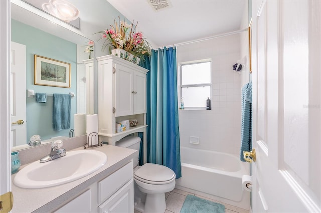 bathroom with toilet, vanity, shower / tub combo with curtain, and tile patterned flooring