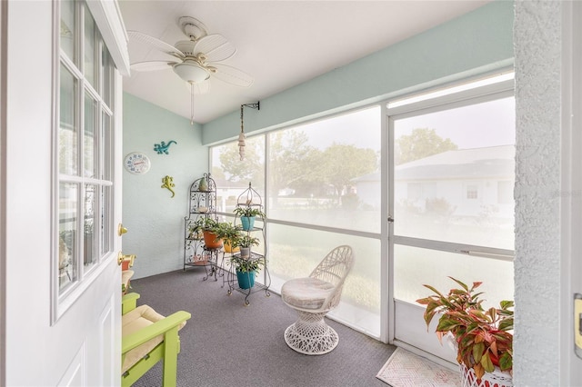 sunroom featuring ceiling fan