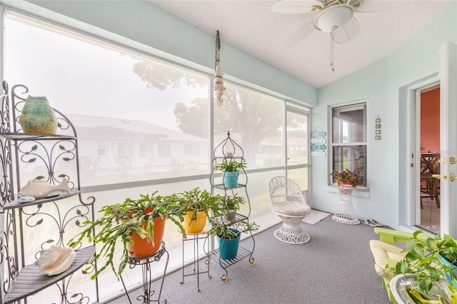 sunroom / solarium with carpet and vaulted ceiling