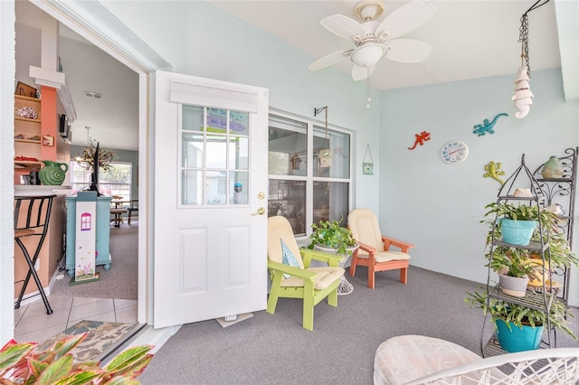 playroom featuring carpet and a ceiling fan