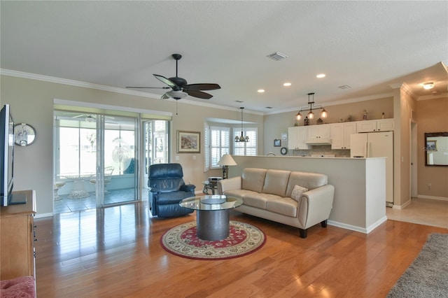 2550 NW 55th Avenue Rd, Ocala, FL 34482 - living area featuring ceiling fan, light wood-style floors, ornamental molding, recessed lighting, and baseboards