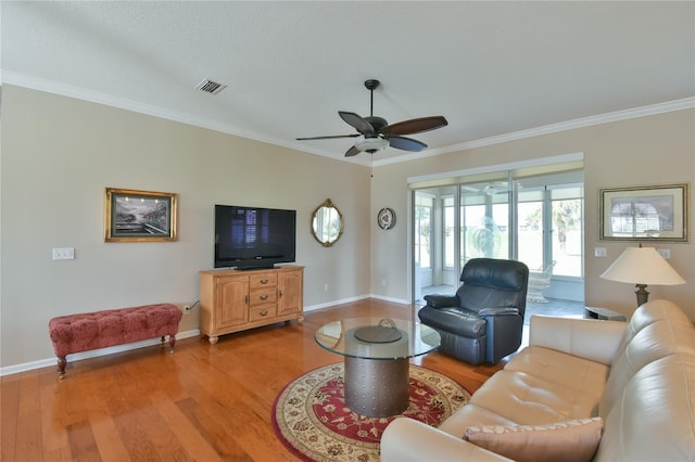 2550 NW 55th Avenue Rd, Ocala, FL 34482 - living room featuring light wood-style floors, ornamental molding, a ceiling fan, and baseboards