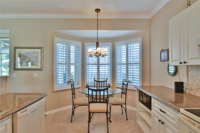 2550 NW 55th Avenue Rd, Ocala, FL 34482 - dining area with healthy amount of natural light, ornamental molding, baseboards, light tile patterned flooring, and a chandelier