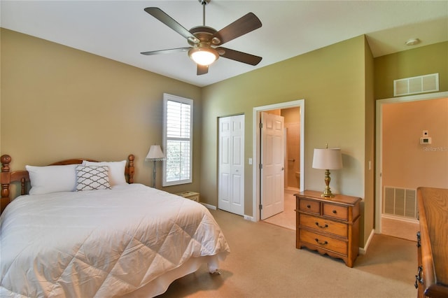 2550 NW 55th Avenue Rd, Ocala, FL 34482 - bedroom featuring light colored carpet, a closet, baseboards, and ensuite bathroom