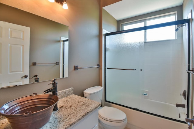 2550 NW 55th Avenue Rd, Ocala, FL 34482 - bathroom with toilet, vanity, and combined bath / shower with glass door