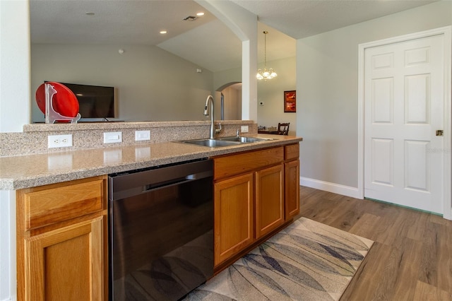 1690 SW 158th Ln, Ocala, FL 34473 - bathroom featuring a sink, wood finished floors, lofted ceiling, a chandelier, and baseboards