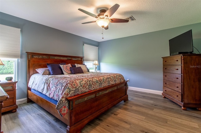 1690 SW 158th Ln, Ocala, FL 34473 - bedroom featuring wood finished floors, baseboards, and a ceiling fan