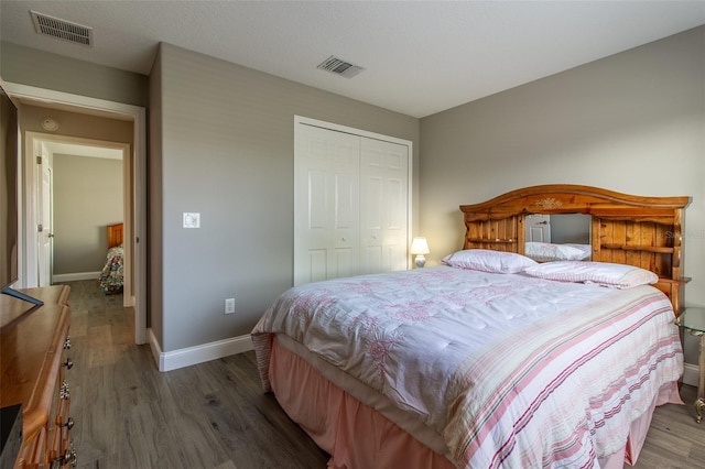 1690 SW 158th Ln, Ocala, FL 34473 - bedroom with wood finished floors, baseboards, and a closet