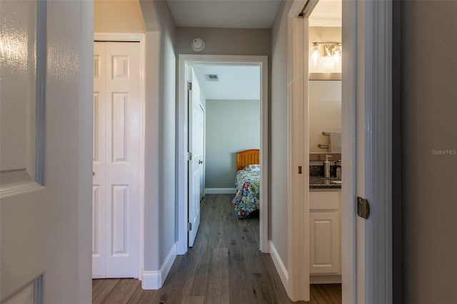 1690 SW 158th Ln, Ocala, FL 34473 - hall with dark wood-style floors and baseboards