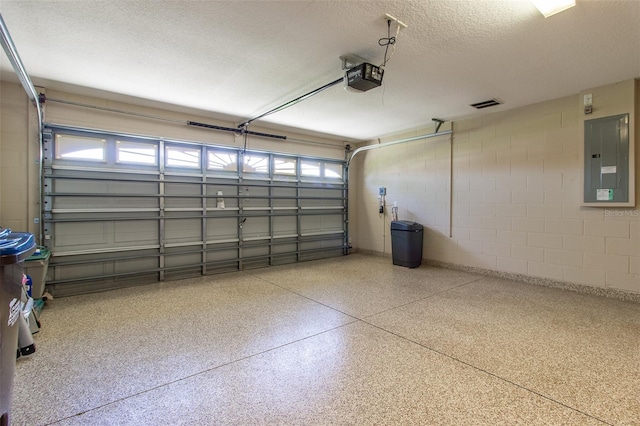 1690 SW 158th Ln, Ocala, FL 34473 - garage with a garage door opener, concrete block wall, and electric panel