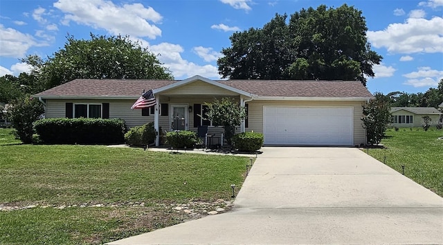 ranch-style home with a front lawn, an attached garage, and concrete driveway