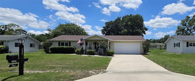 single story home featuring driveway, a front lawn, and an attached garage