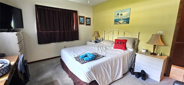 carpeted bedroom with baseboards