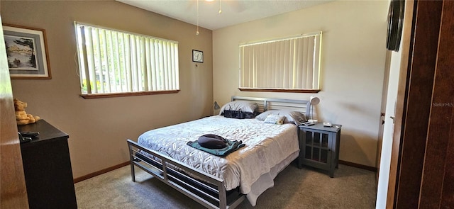 bedroom featuring carpet flooring and baseboards