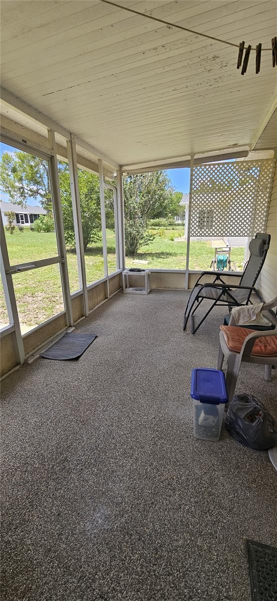unfurnished sunroom featuring plenty of natural light