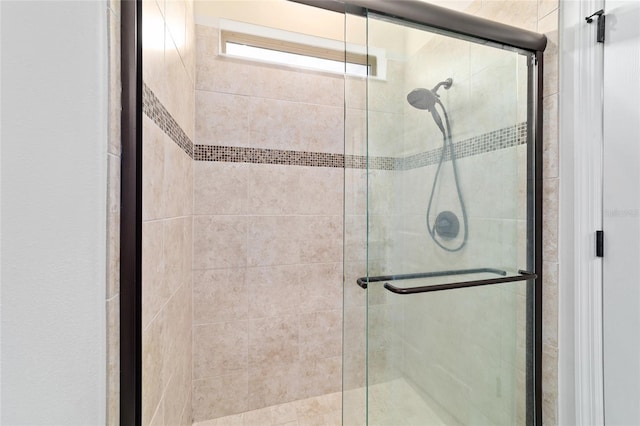 bathroom featuring a shower stall
